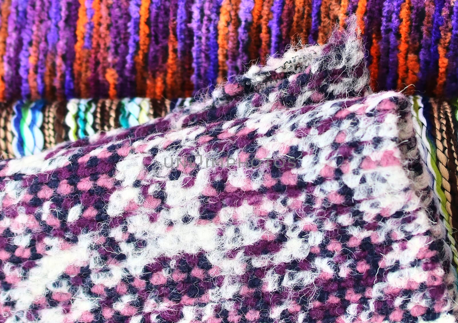 Detailed close up view on samples of cloth and fabrics in different colors found at a fabrics market.