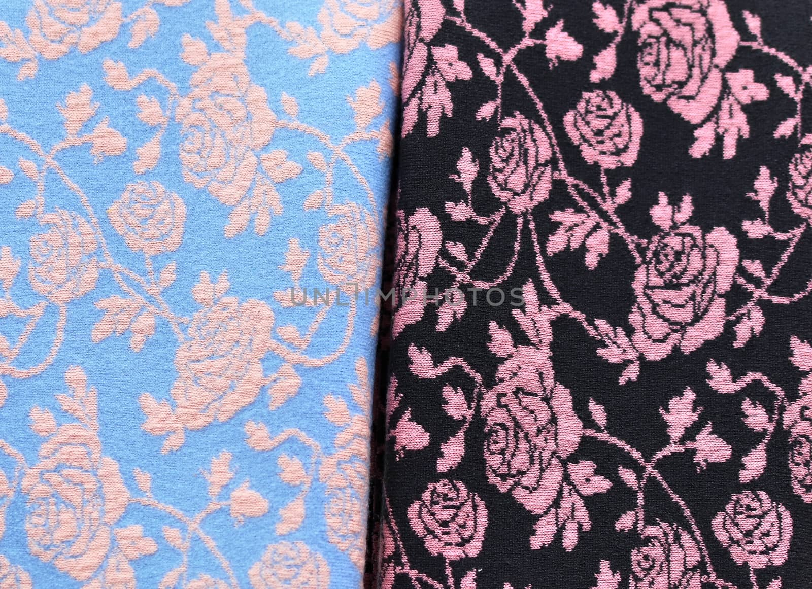 Detailed close up view on samples of cloth and fabrics in different colors found at a fabrics market.