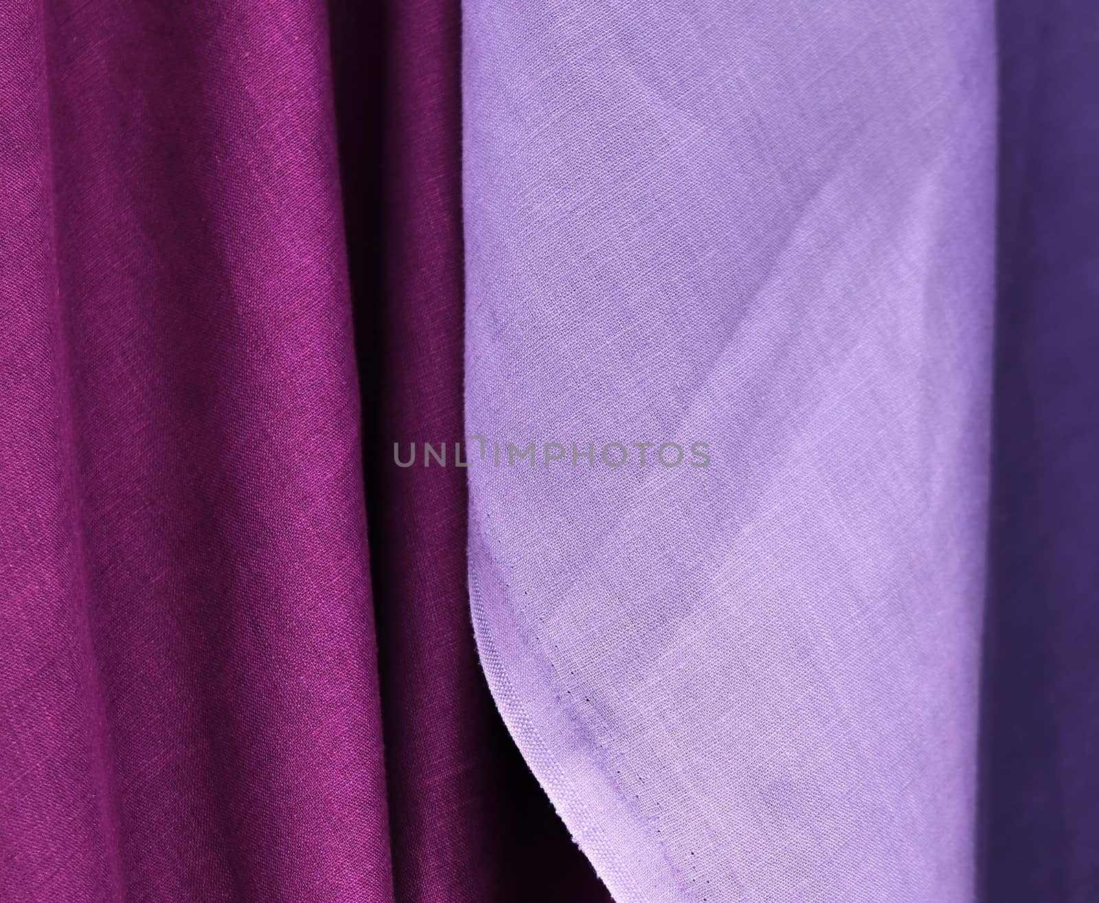 Detailed close up view on samples of cloth and fabrics in different colors found at a fabrics market.