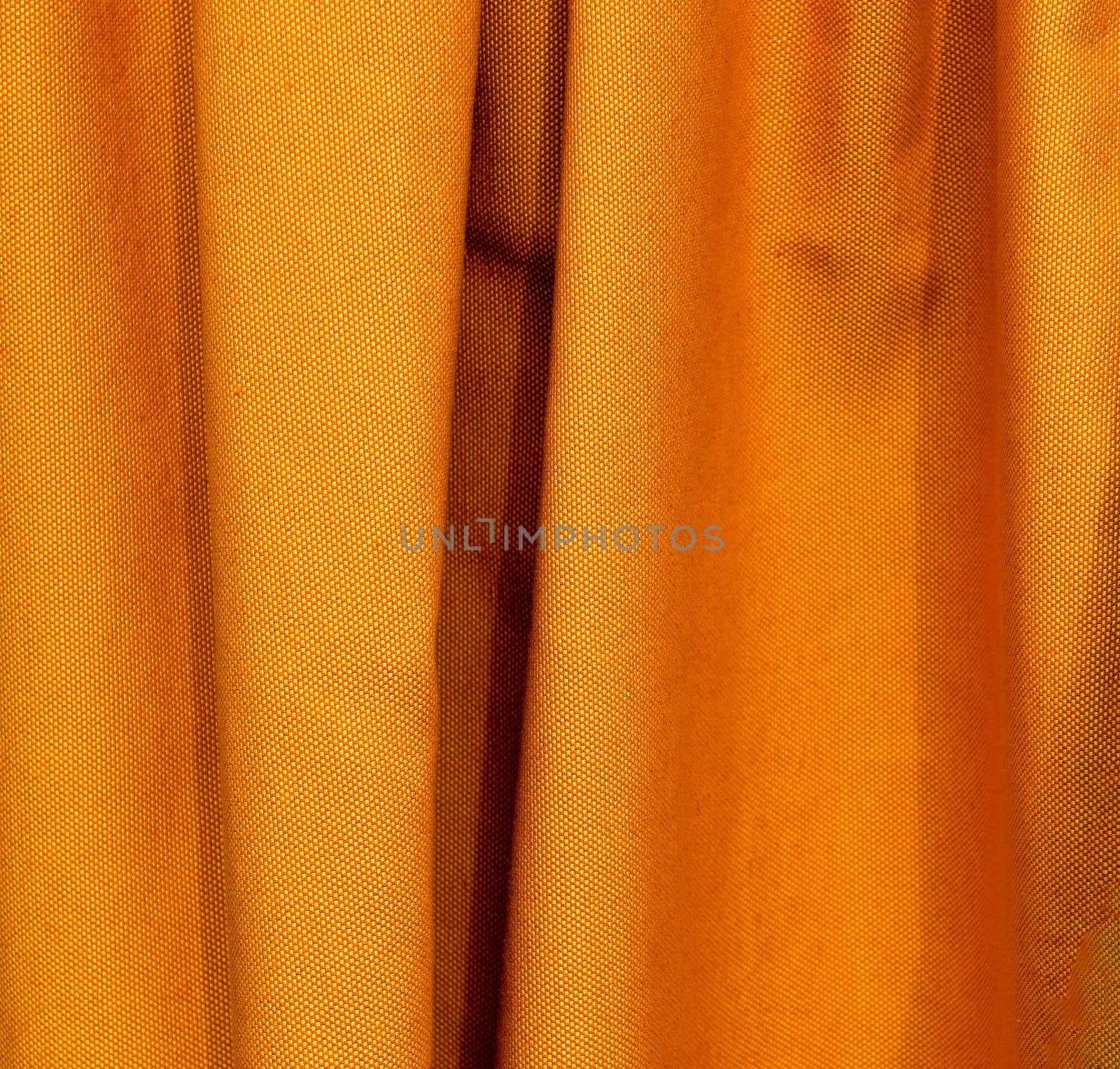 Detailed close up view on samples of cloth and fabrics in different colors found at a fabrics market.