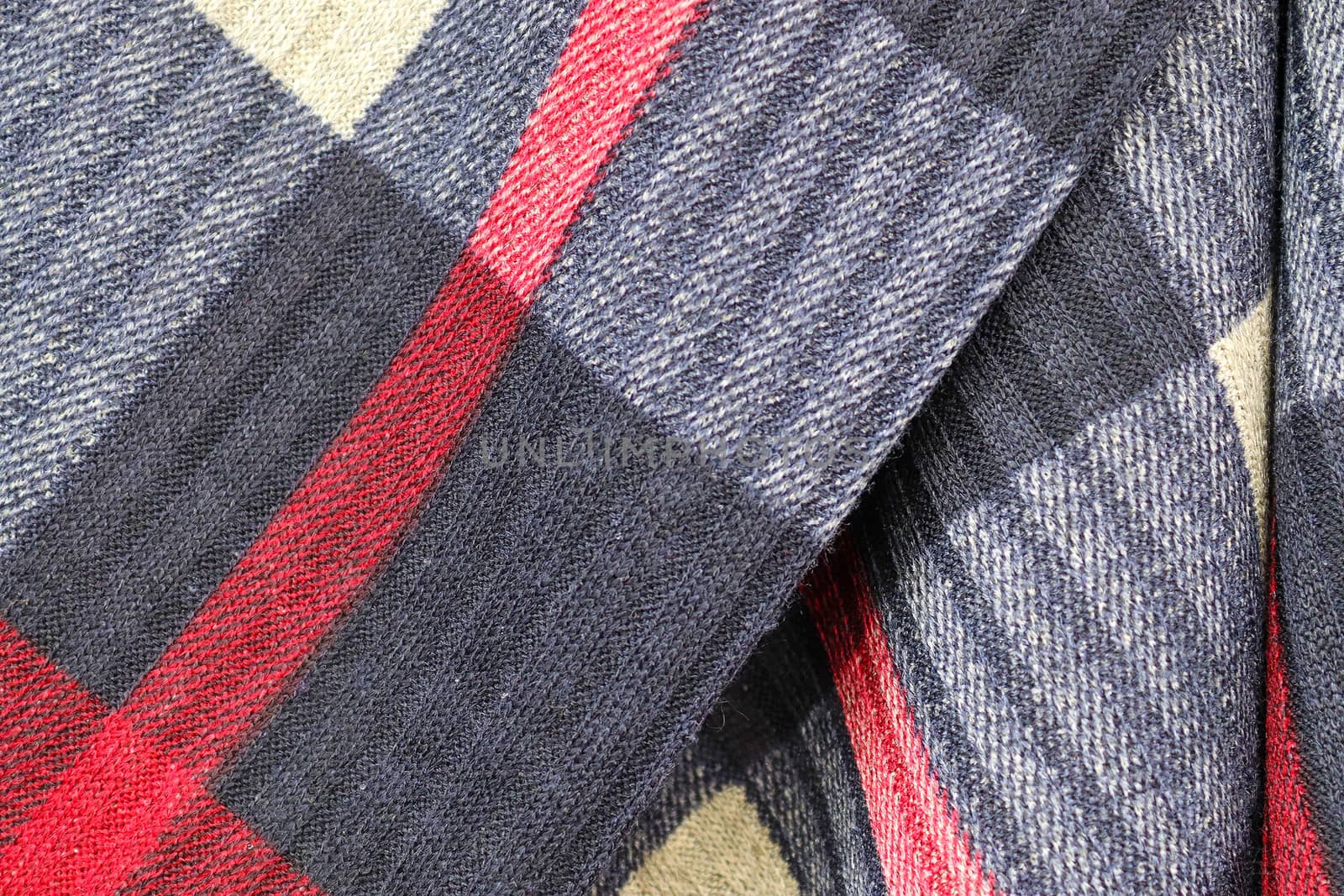 Detailed close up view on samples of cloth and fabrics in different colors found at a fabrics market.