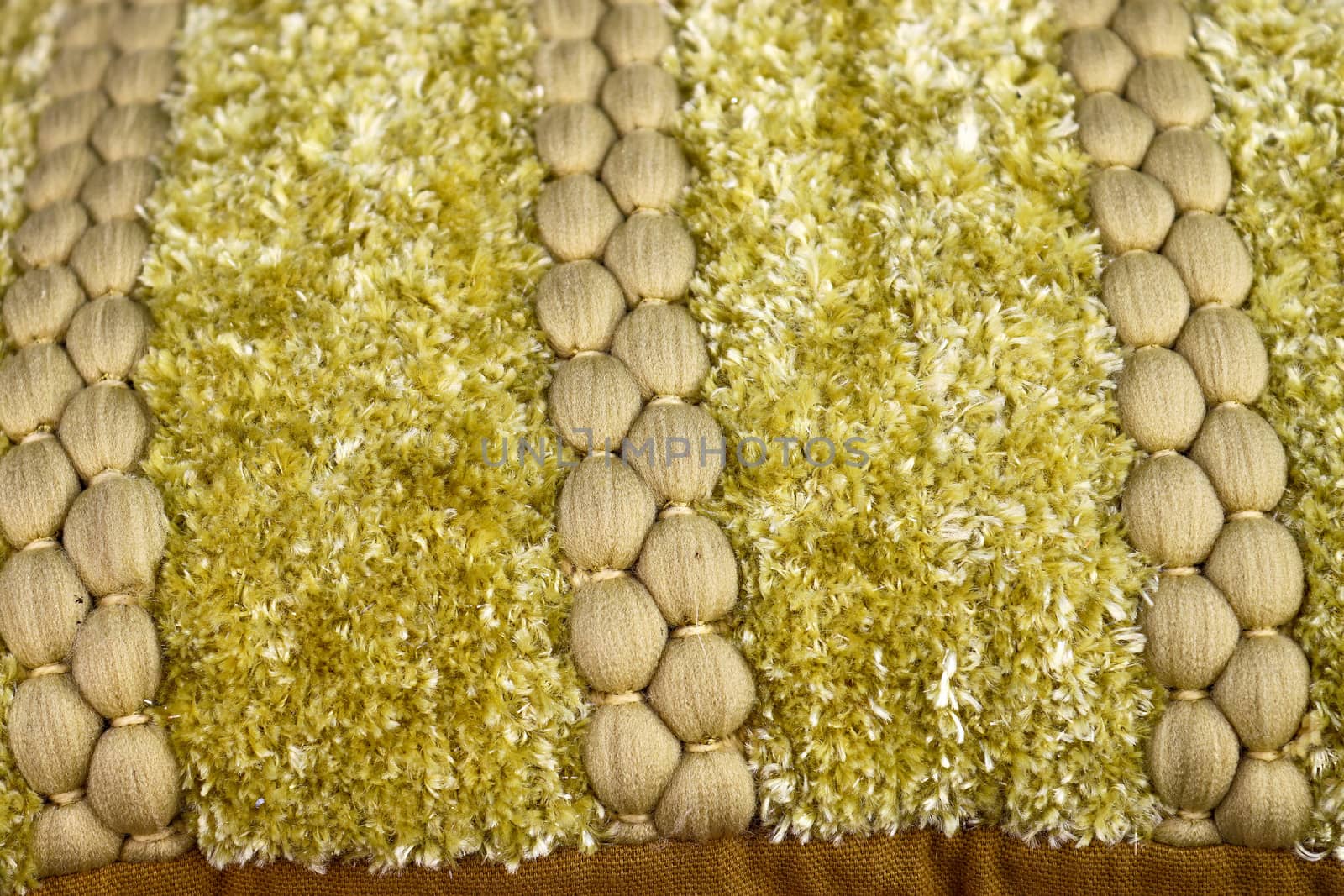 Detailed close up view on samples of cloth and fabrics in different colors found at a fabrics market.