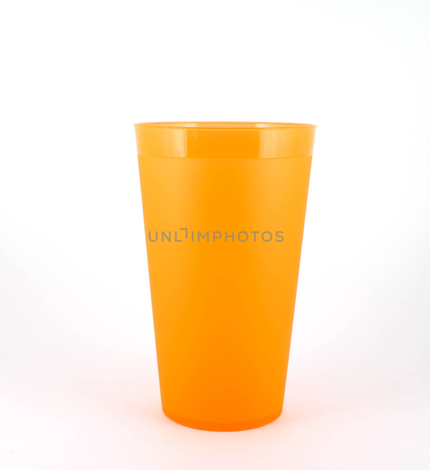 Orange plastic cup over white