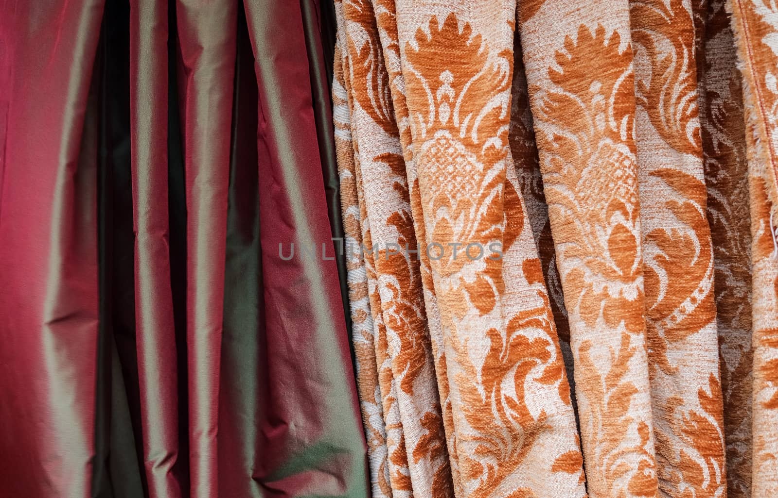 Detailed close up view on samples of cloth and fabrics in different colors found at a fabrics market.