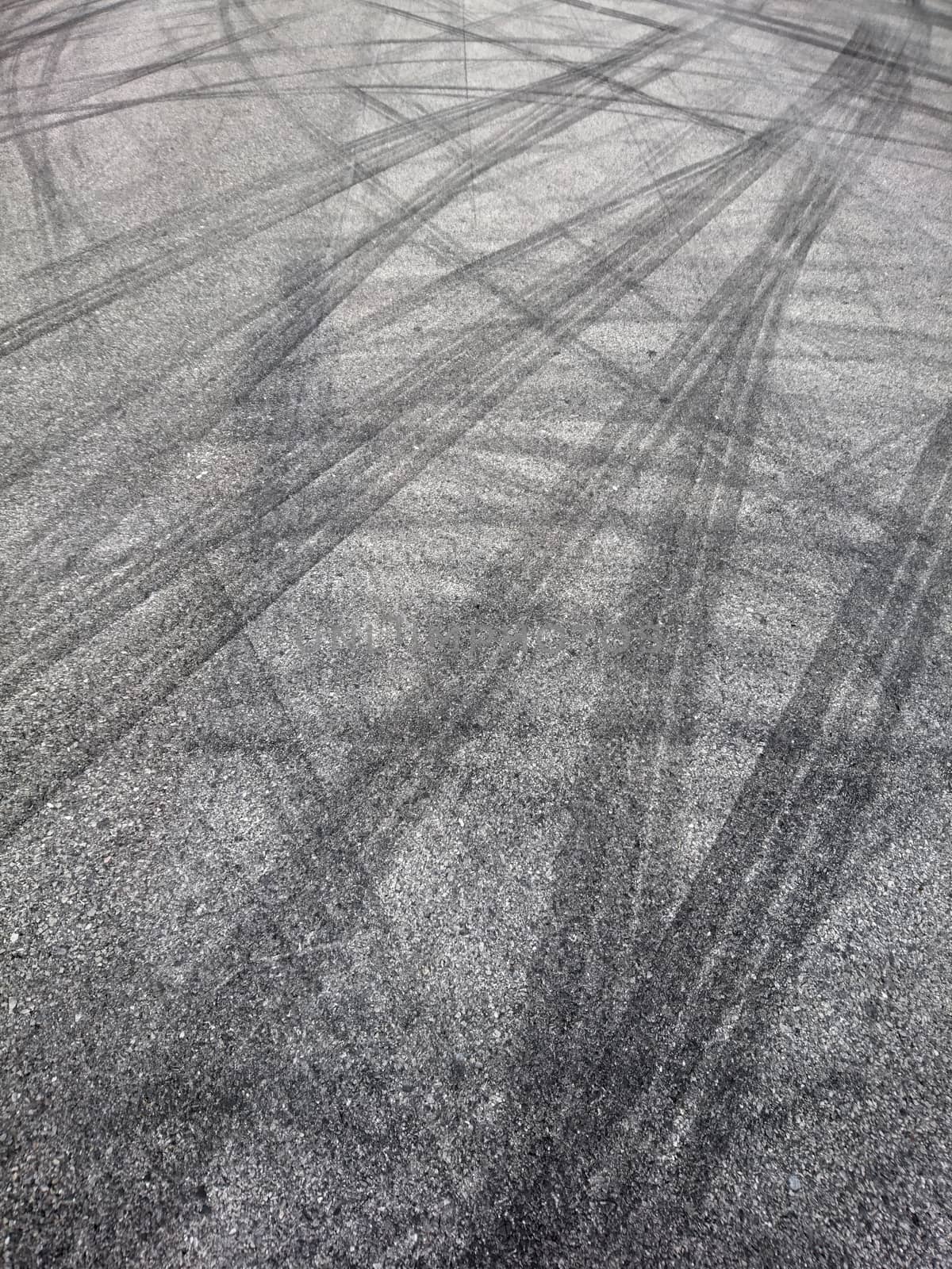 Background with tire marks on road by liewluck