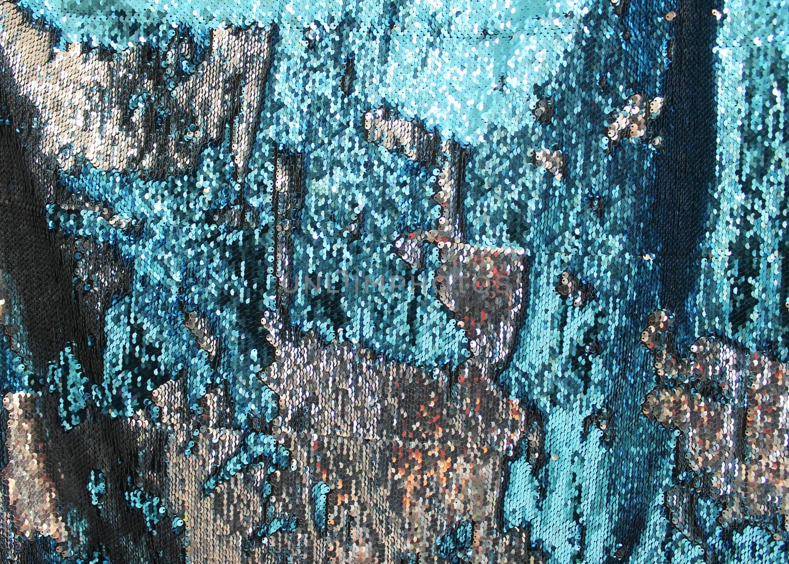 Detailed close up view on samples of cloth and fabrics in different colors found at a fabrics market.