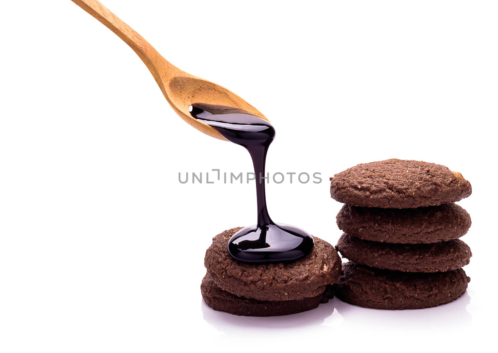Chocolate cookies and chocolate topping on white background