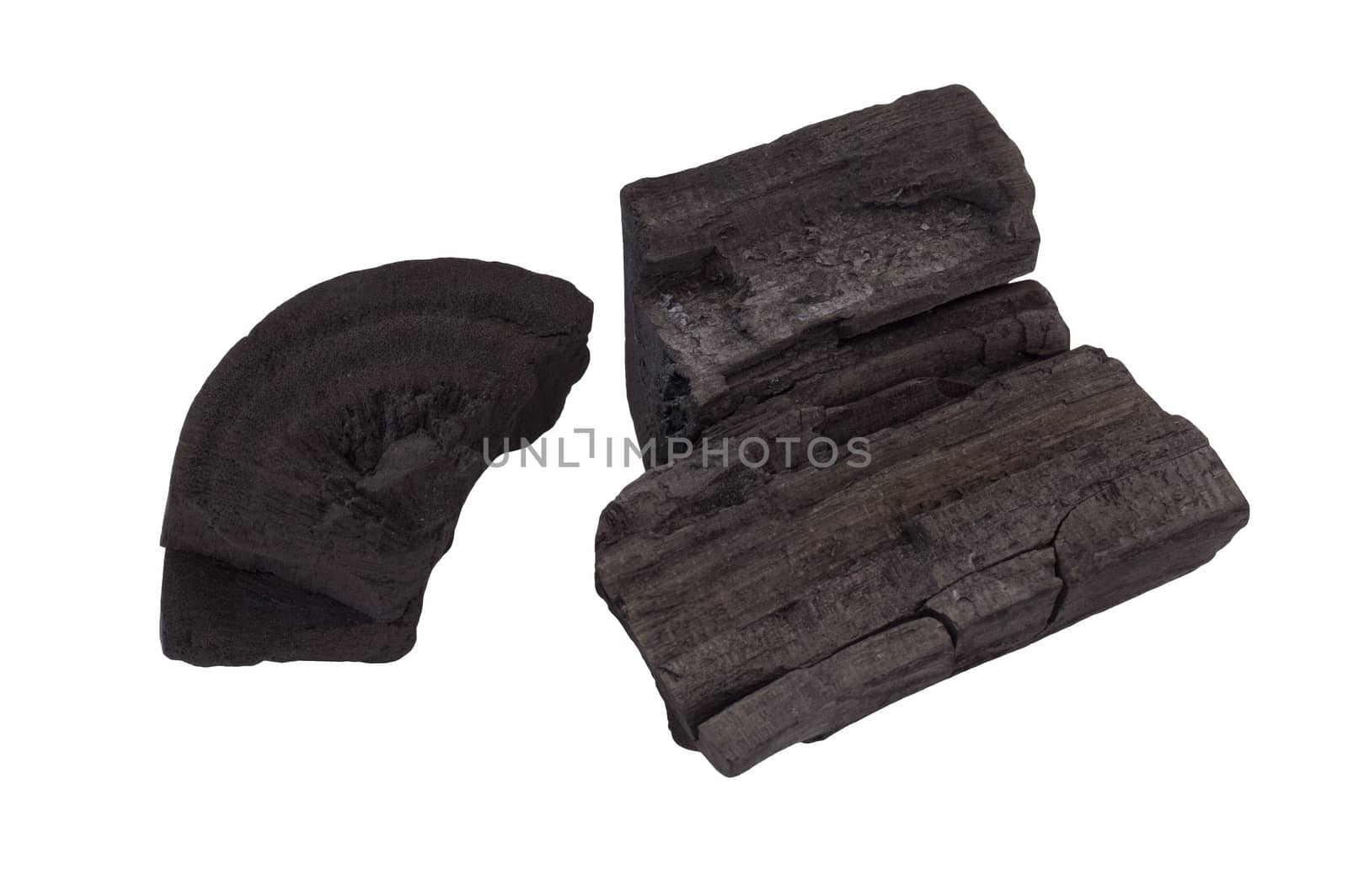 Picture of raw black charcoal on white background 