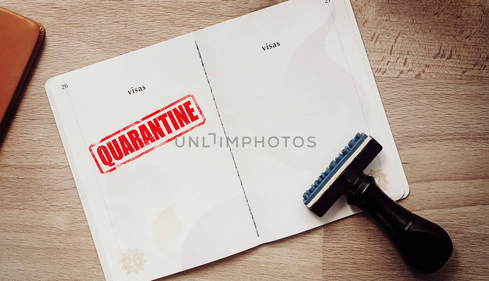 stamp for those who are quarantine in a coronavirus epidemic outbreak situation on passport page for tourist who have a high risk of being infected with a Wuhan virus.