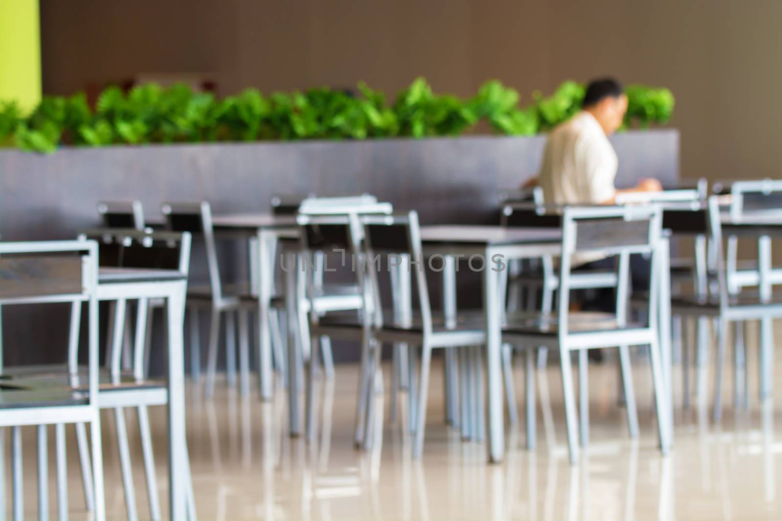 Customer at restaurant, blurred background