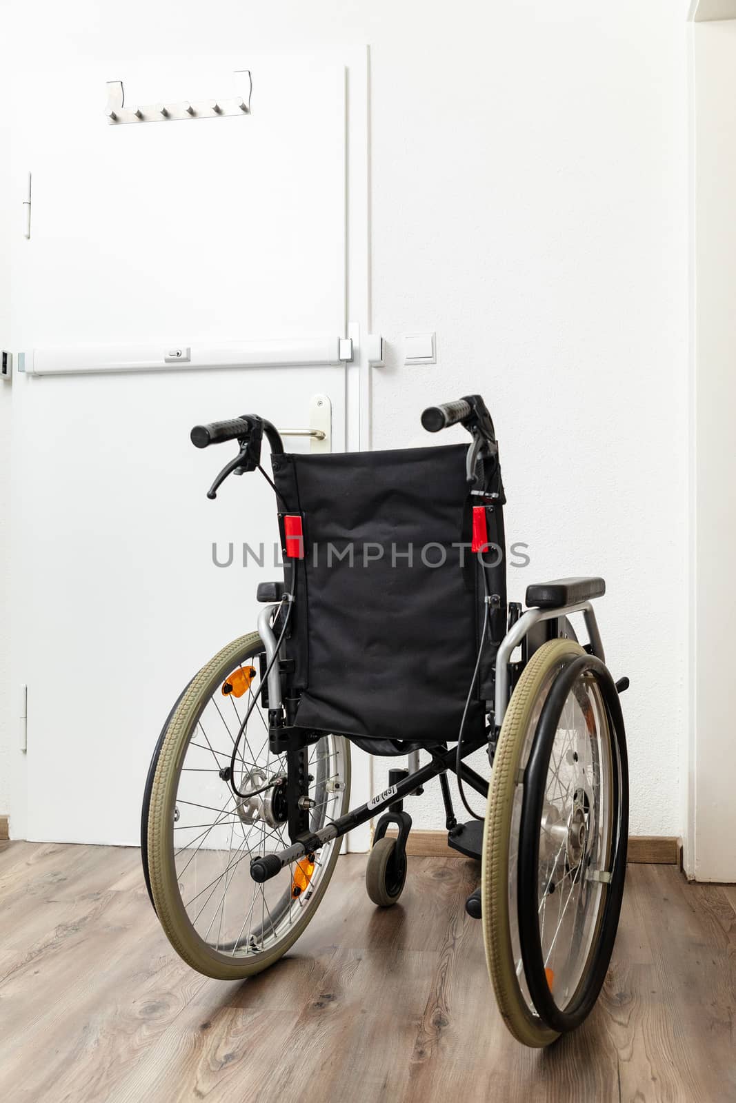 An image of a wheelchair at an apartment door