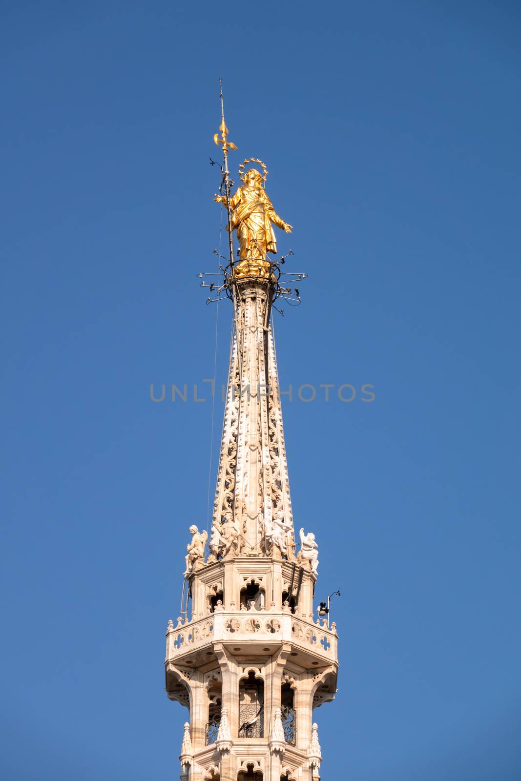 An image of the beautiful golden Madonna statue at Cathedral Milan Italy