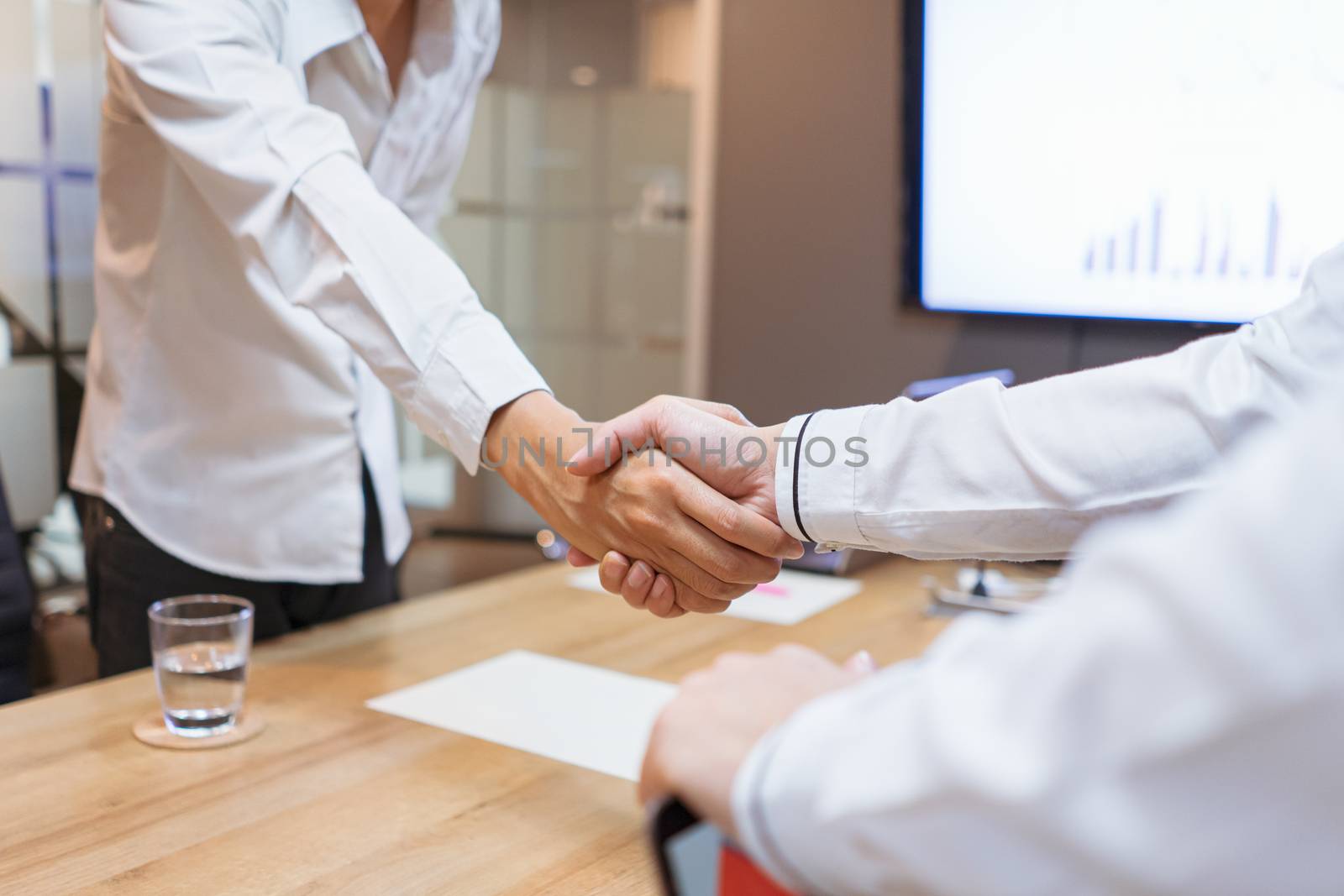 Business people shake hands to finish the meeting , Hand in hand to work together