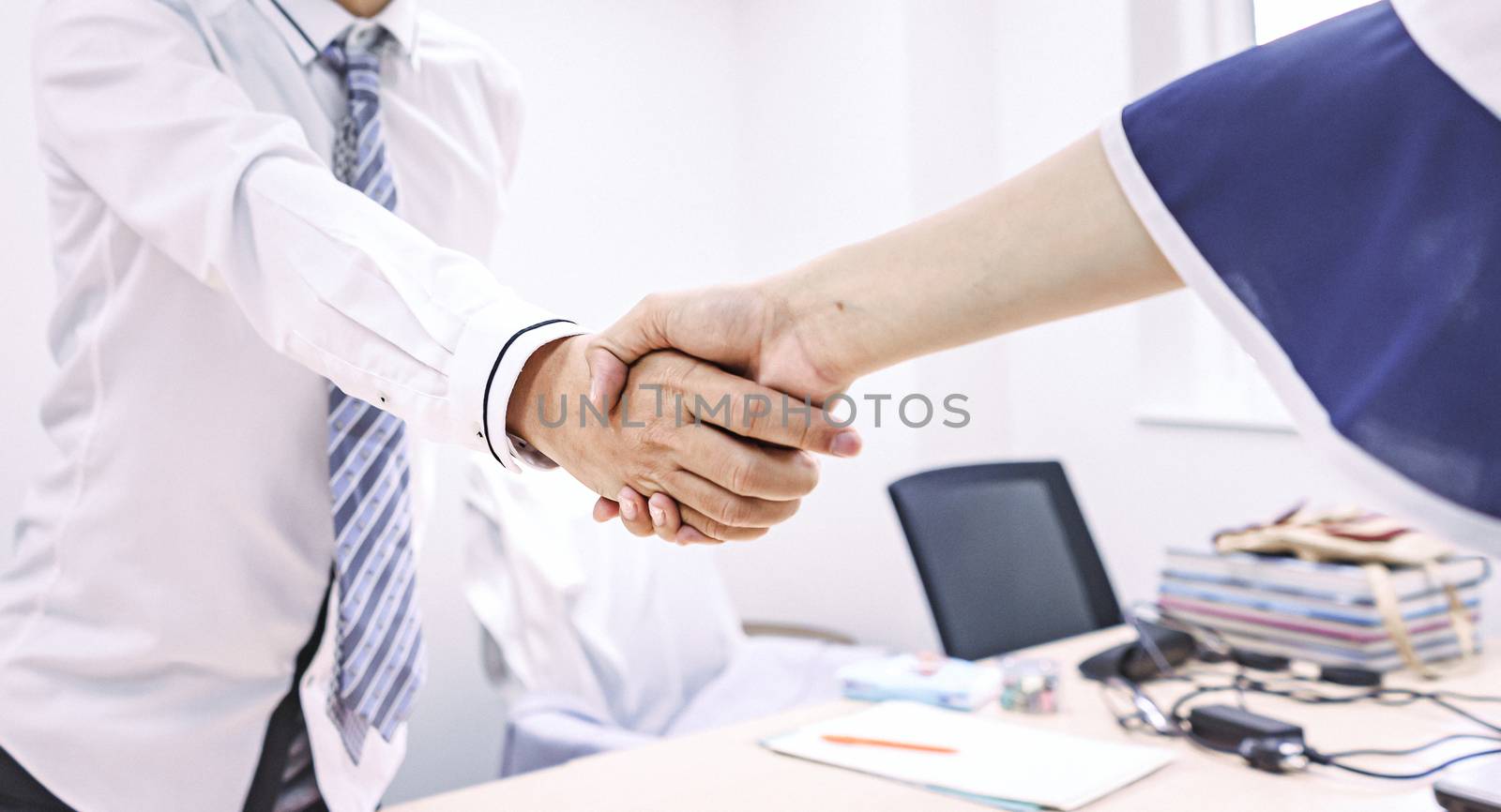 Business people shake hands to finish the meeting , Hand in hand to work together