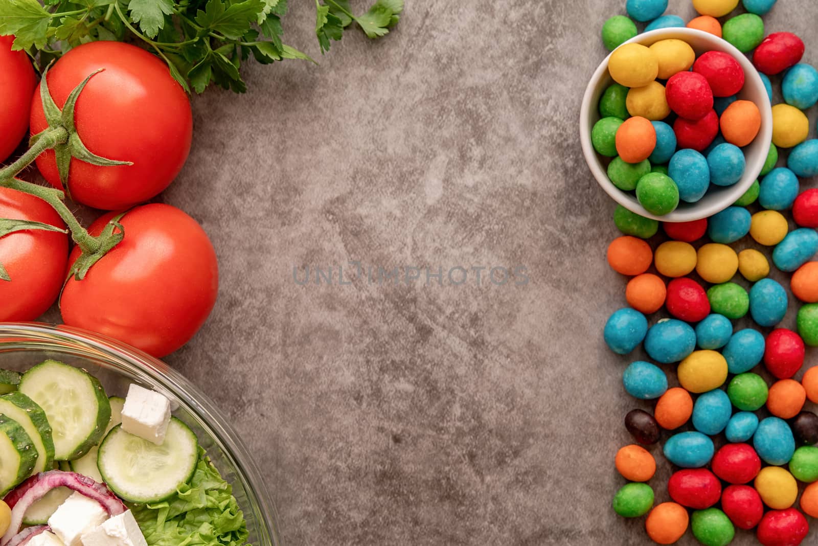 Healthy and unhealthy food concept. Fresh vegetables vs sweets top view flat lay with copy space