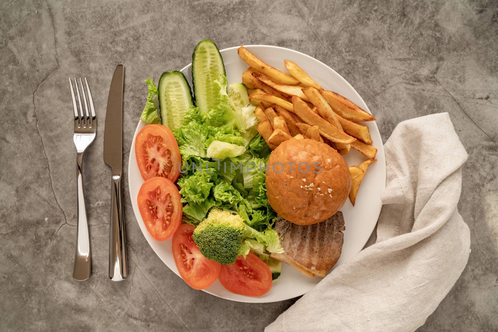 Healthy and unhealthy food concept. Fast food and healthy diet on one plate