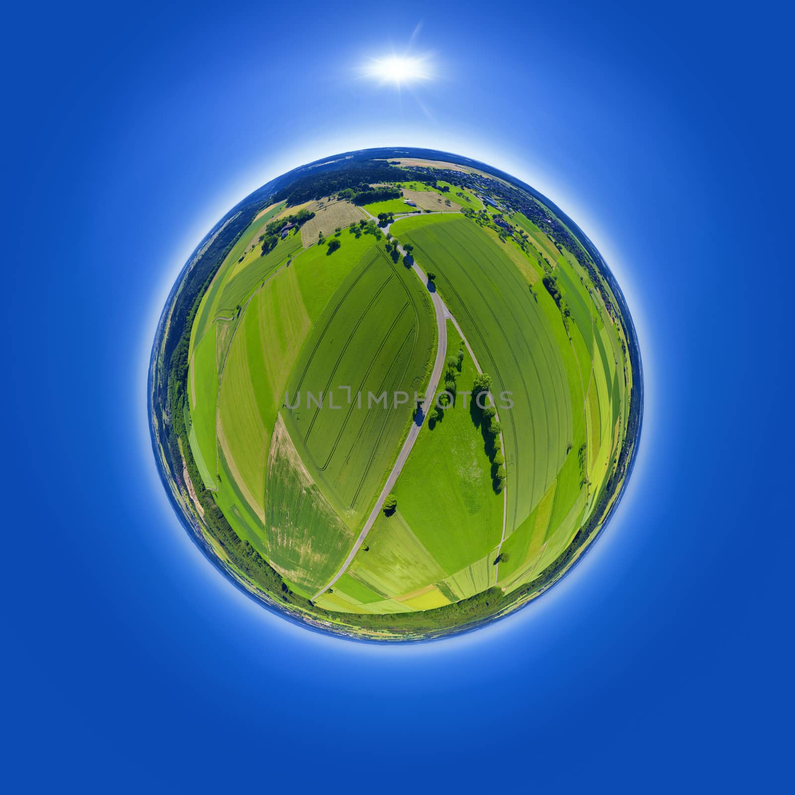 An image of a little planet rural fields and road