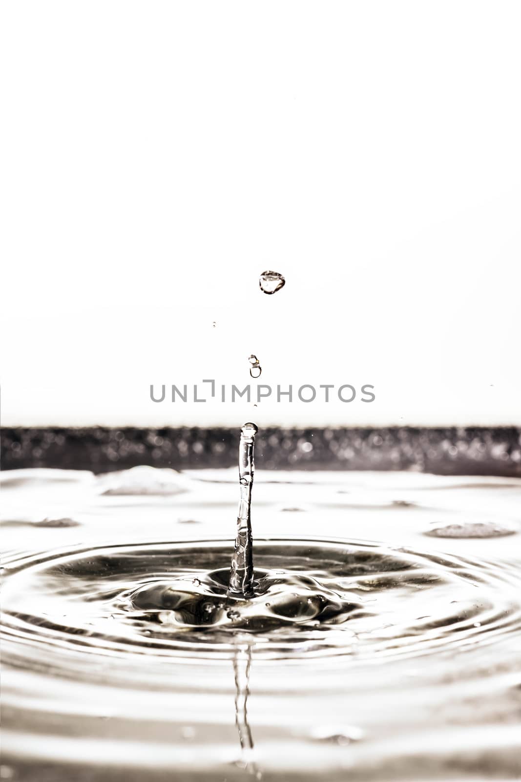 An image of a beautiful black water drop background tilt