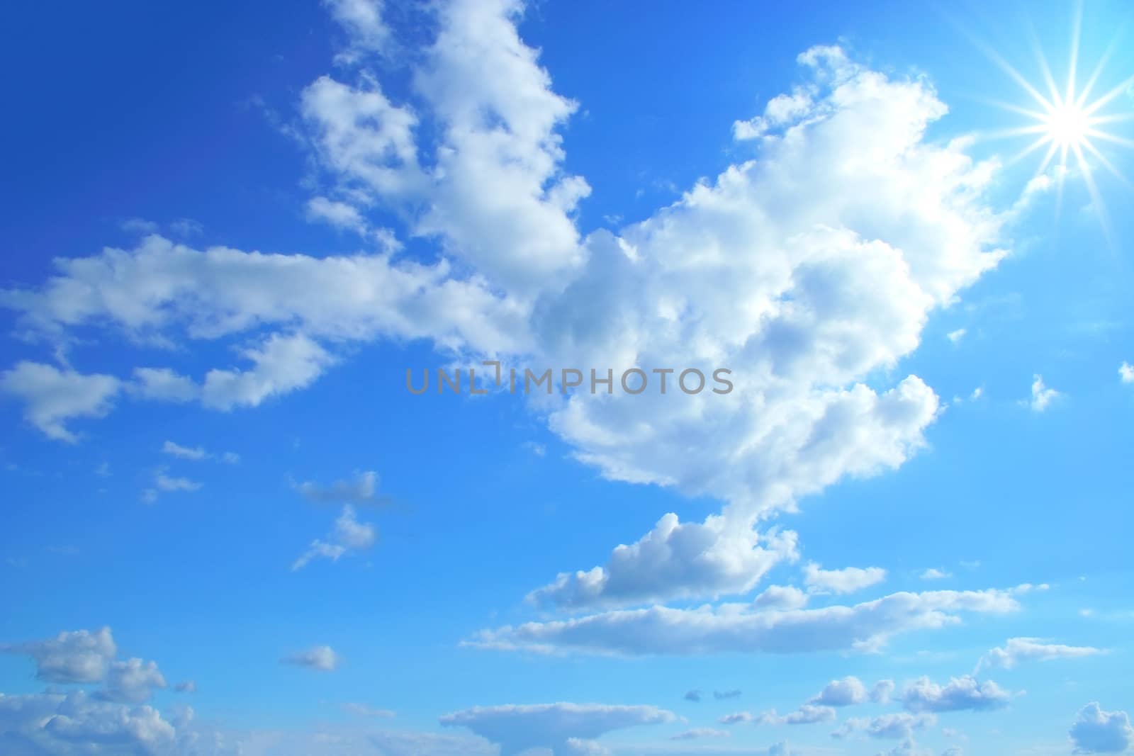 A photography of a blue sky sun clouds texture