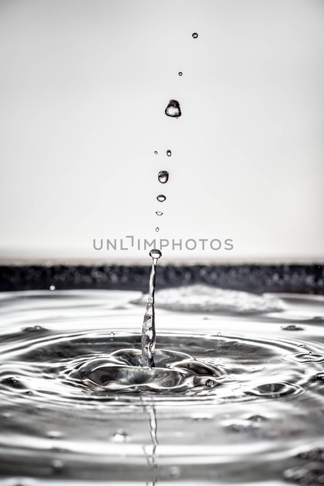 An image of a beautiful black water drop background