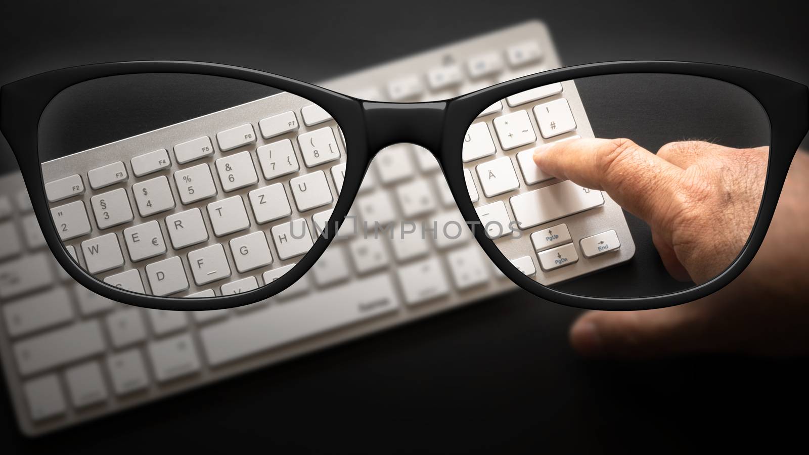 glasses with keyboard sharp and blurred by magann