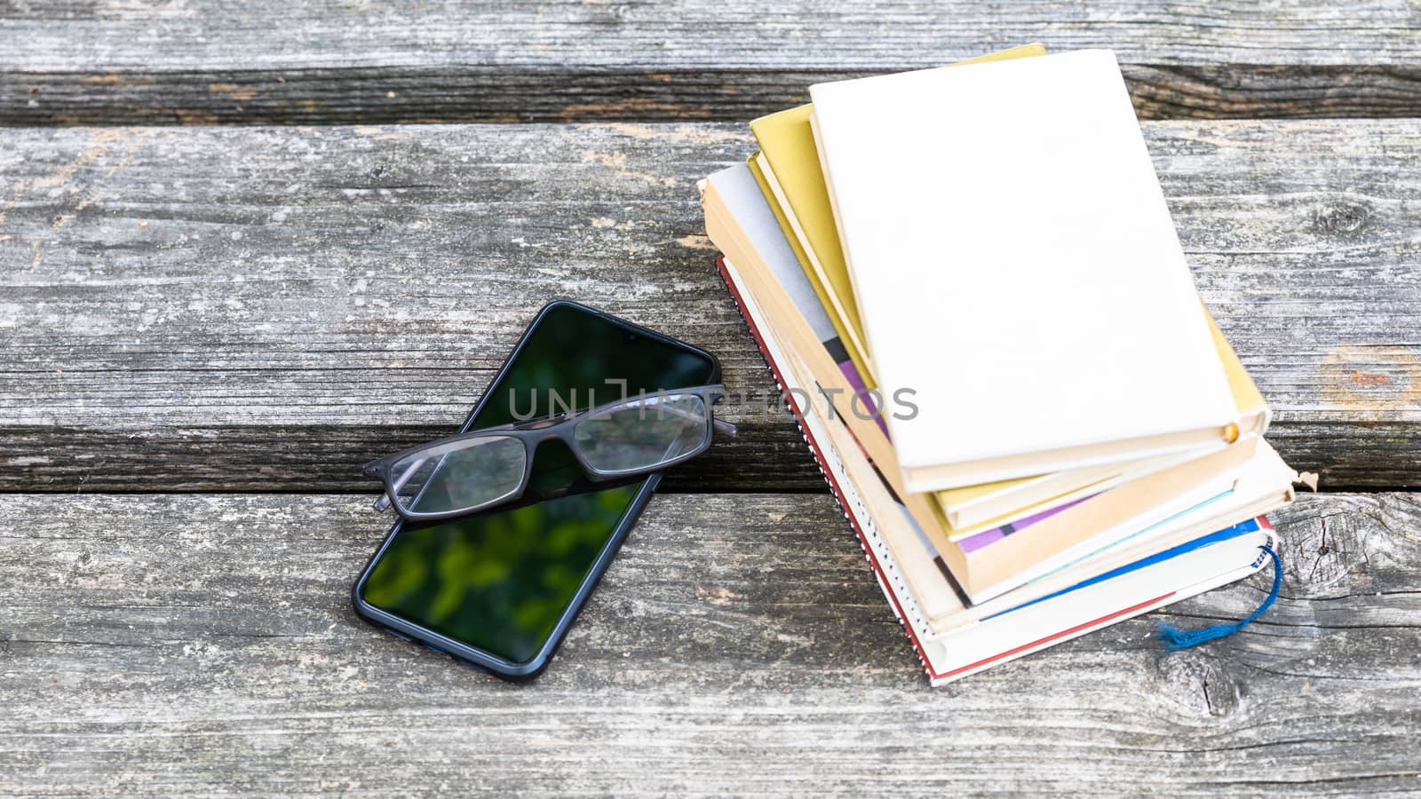 books and reading glasses by magann