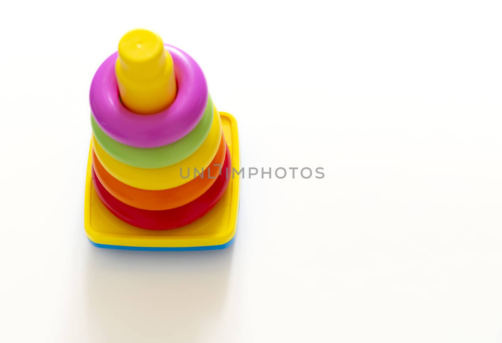 Colorful plastic ring tower for kids seen from above by rarrarorro