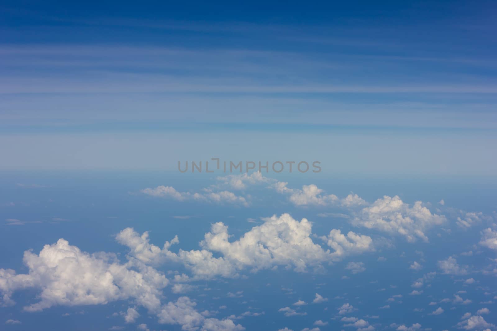 Sky and clouds bird's eye view on the plane