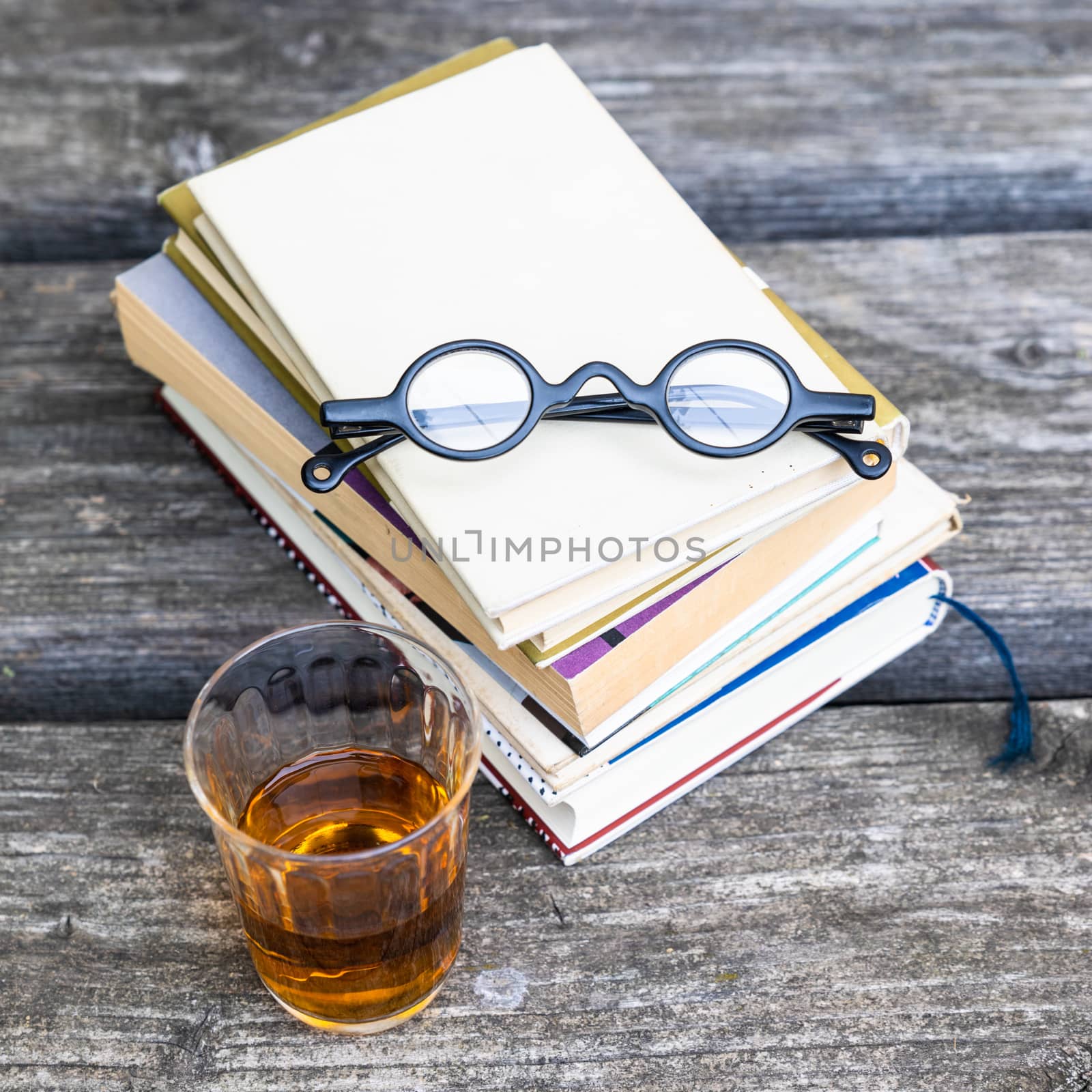 An image of some books and reading glasses background