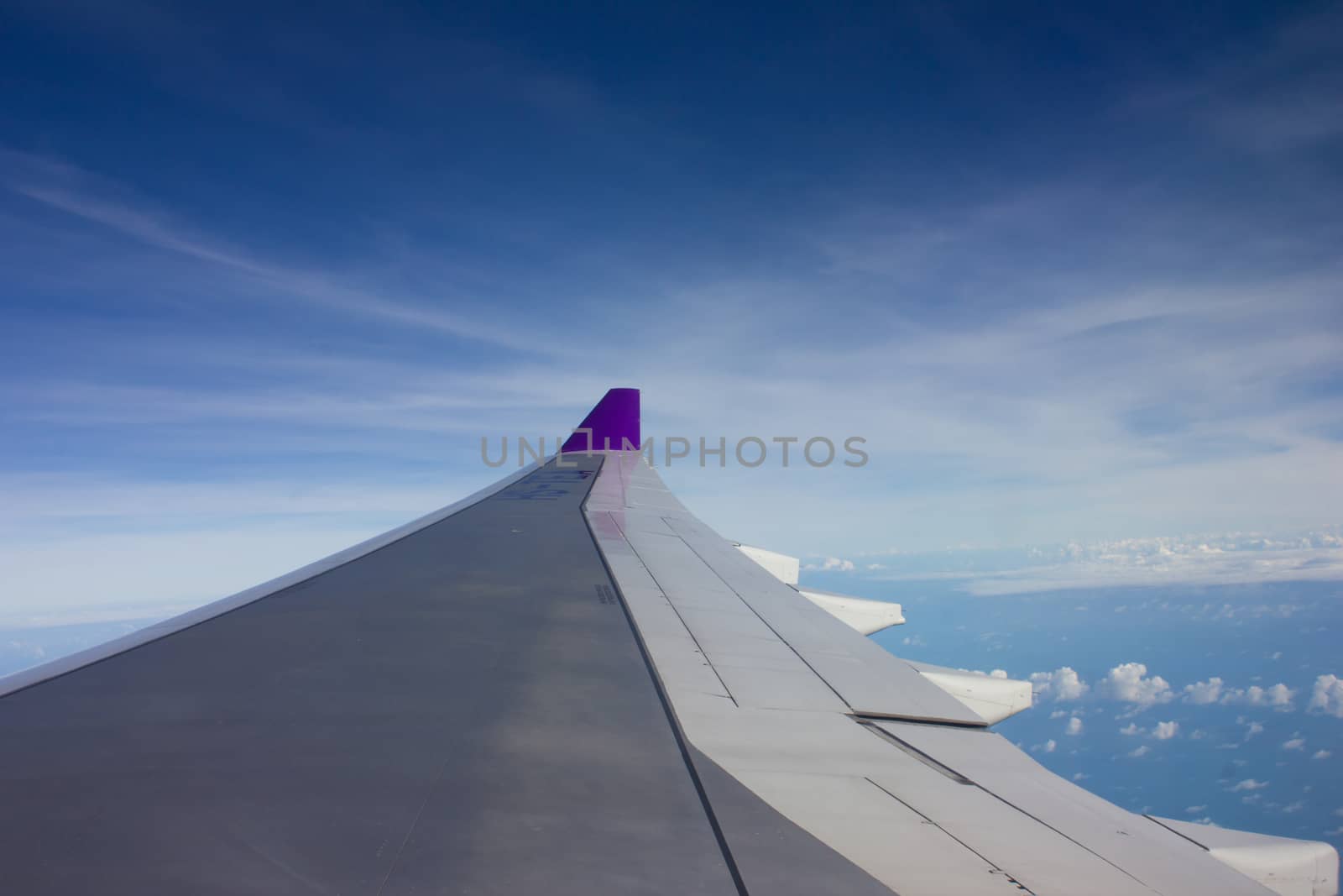 Sky and clouds bird's eye view of the himalayas on the plane