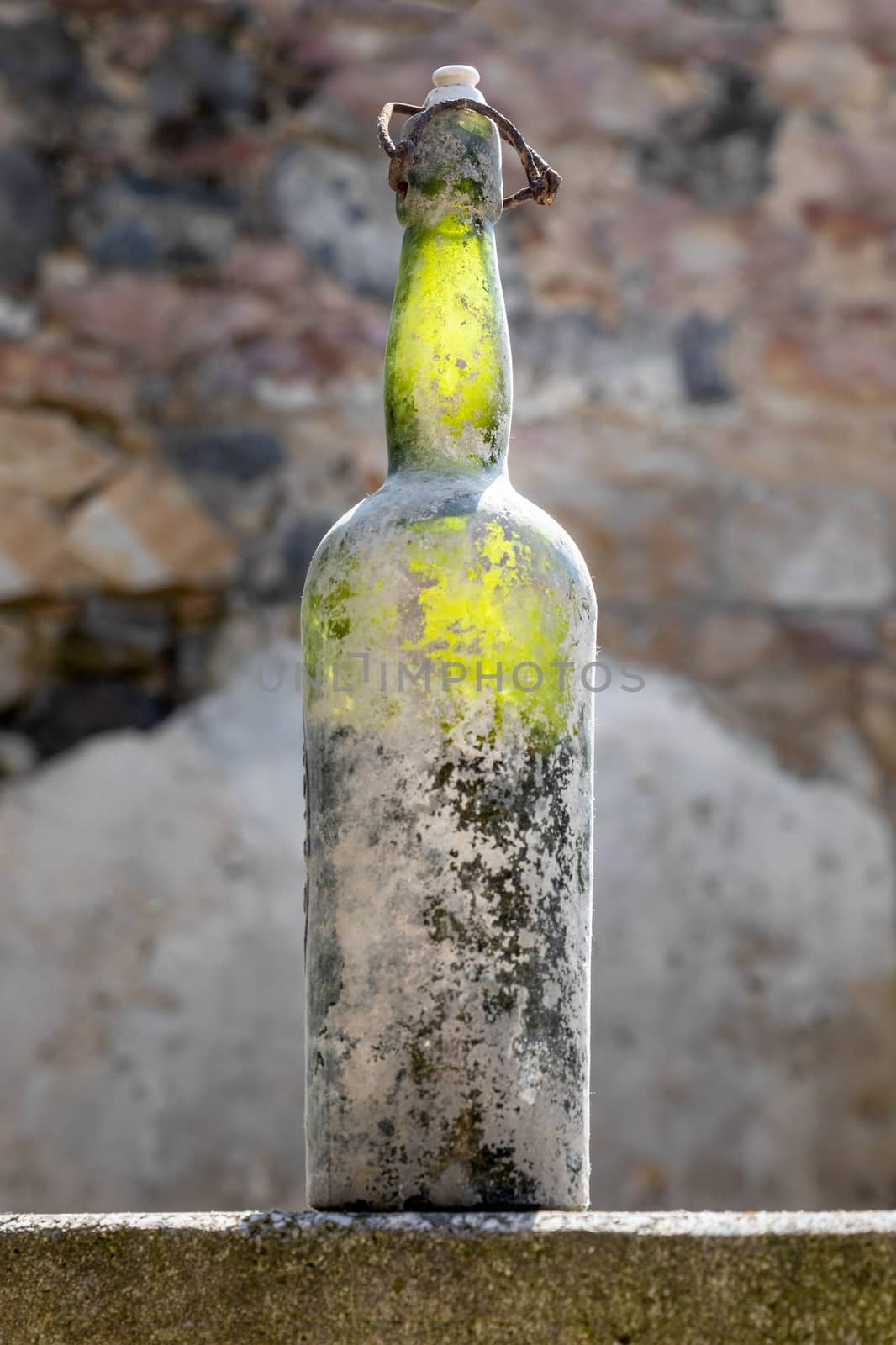 An image of a dirty old wine bottle