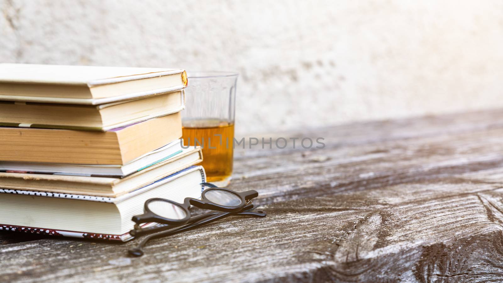 books and reading glasses by magann