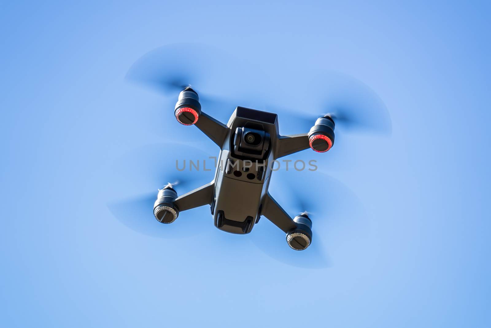 An image of a toy drone blue sky background