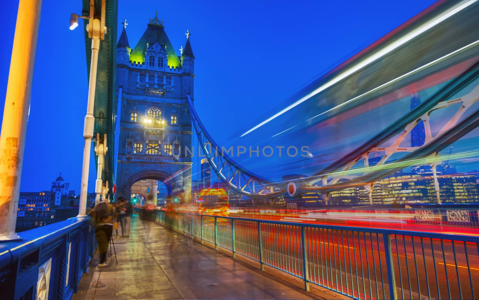 Vehicles pass over Tower Bridge across the River Thames in London, UK.