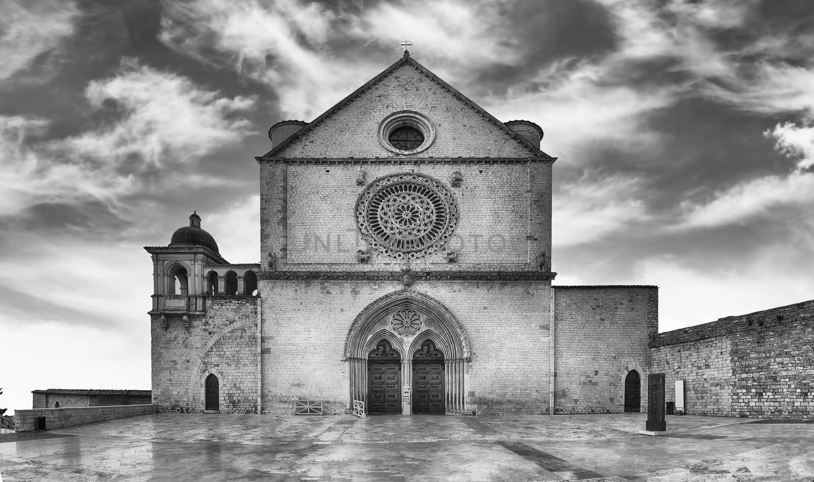 Facade of the Papal Basilica of Saint Francis of Assisi, one of the most important places of Christian pilgrimage in Italy. UNESCO World Heritage Site since 2000