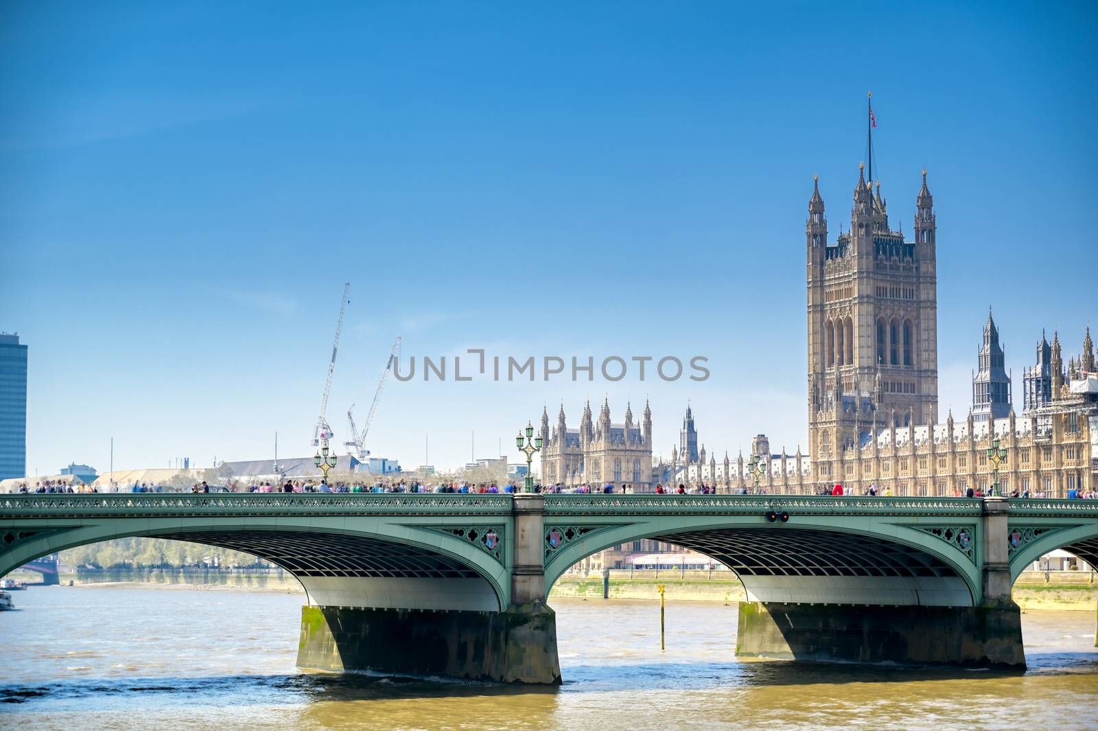 British Parliament along the River Thames on a sunny day in London, UK.