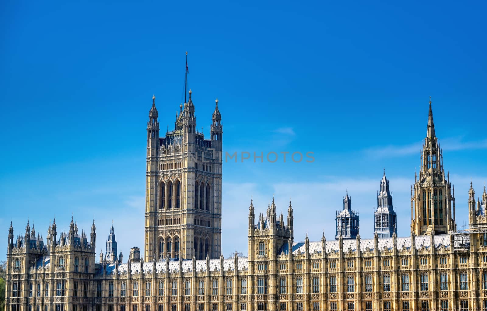 British Parliament along the River Thames on a sunny day in London, UK.