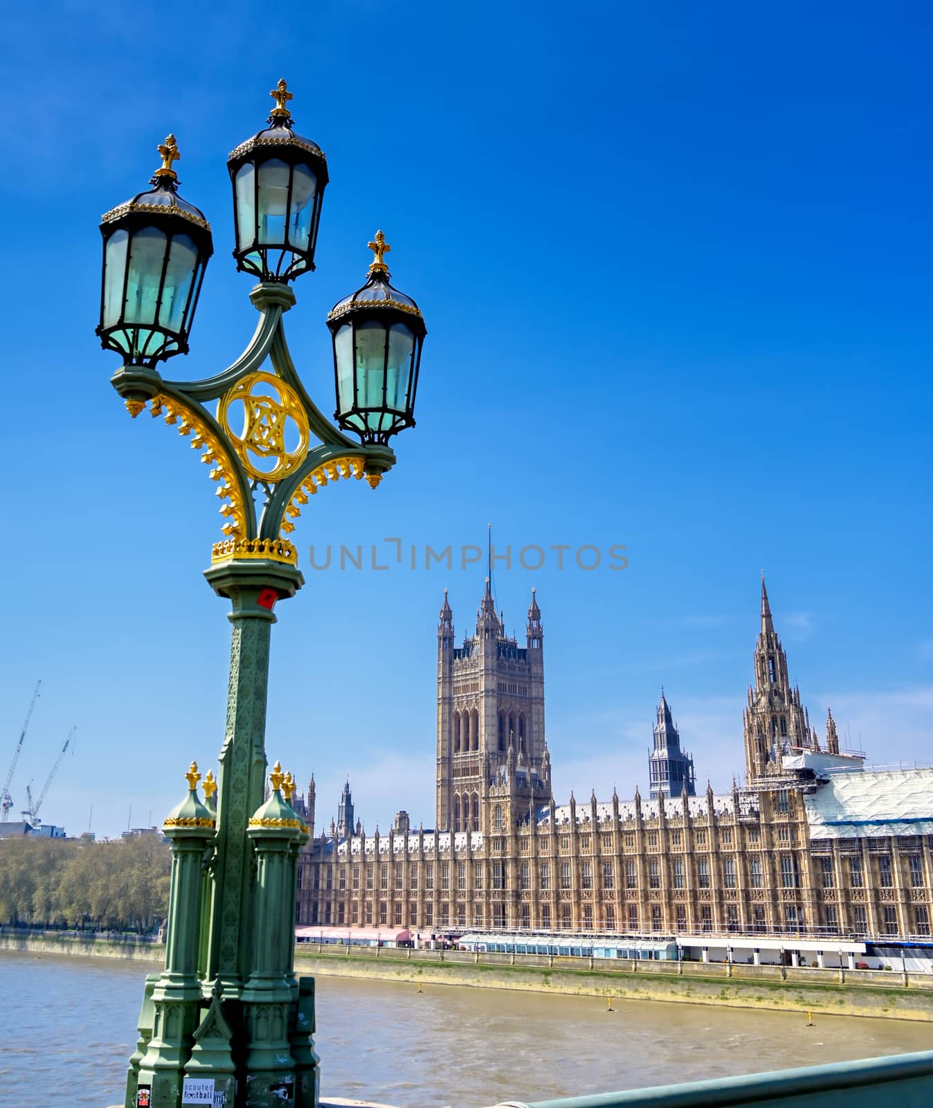 British Parliament along the River Thames on a sunny day in London, UK.