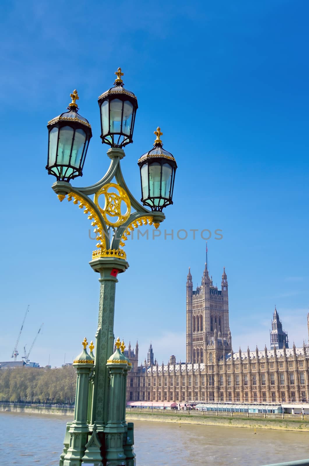 British Parliament along the River Thames on a sunny day in London, UK.