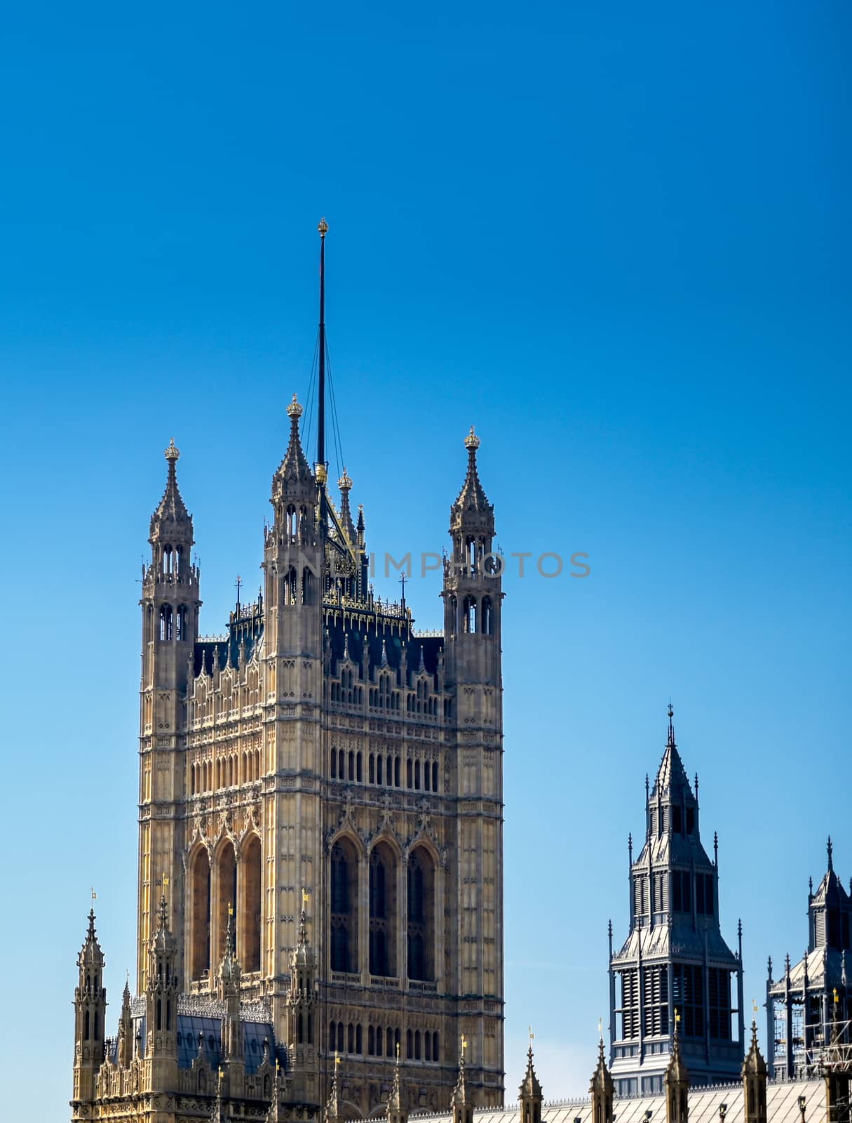 British Parliament along the River Thames on a sunny day in London, UK.