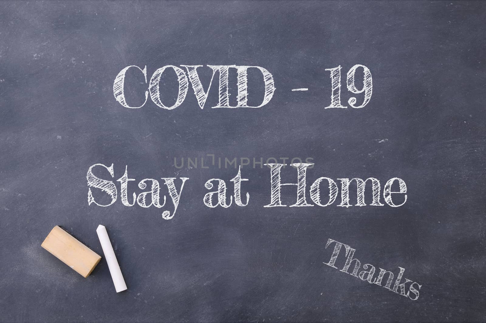 Coronavirus pandemic behaviour rules or health advice. Covid-19 Stay at Home chalkboard inscription.