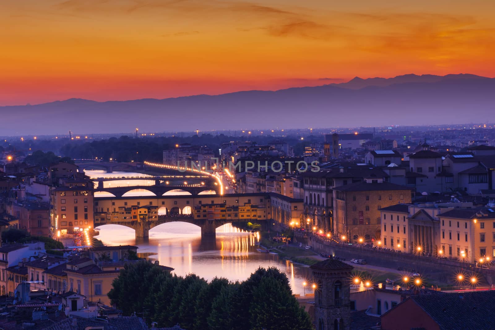 Panorama of famous bridge Ponte Vecchio at sunset in Florence, Tuscany, Italy