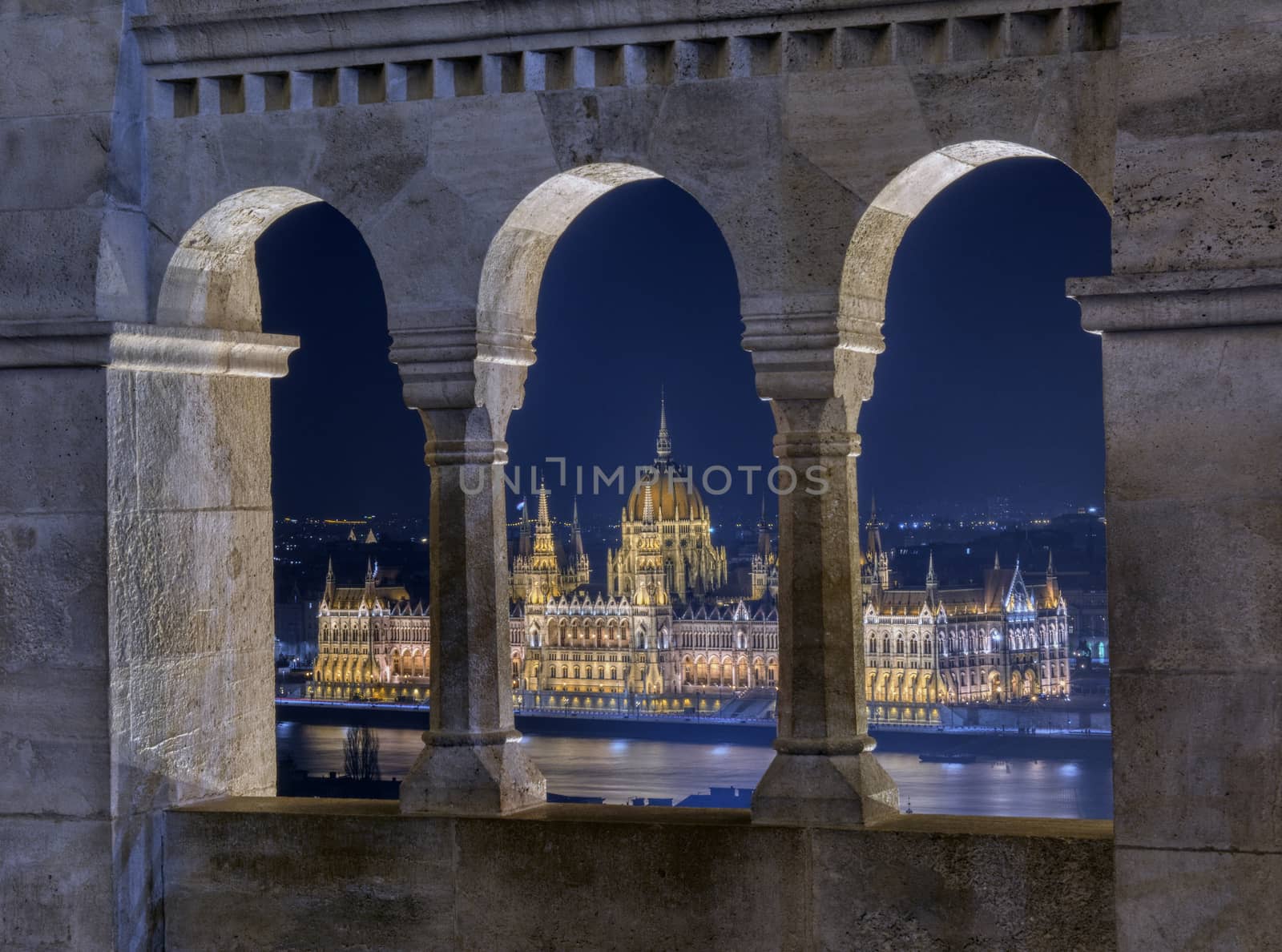 Hungarian Parliament through Fishermans bastion arcades, Budapest.