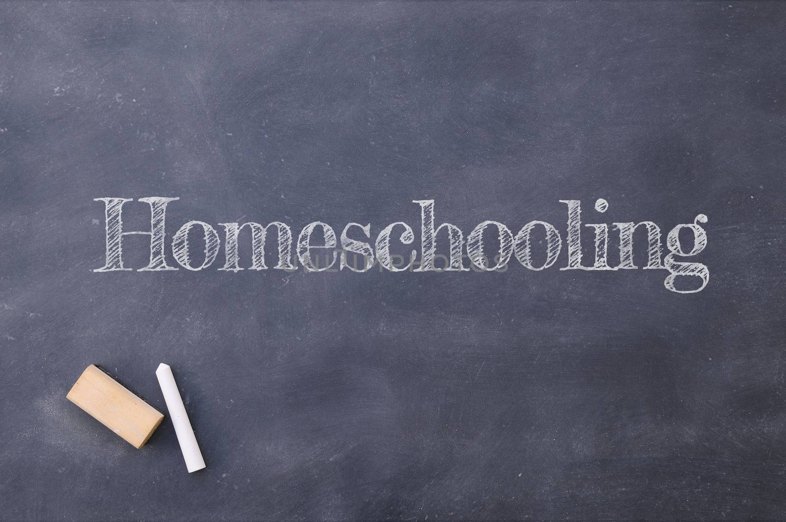 Homeschooling written on a vintage blackboard. by CreativePhotoSpain