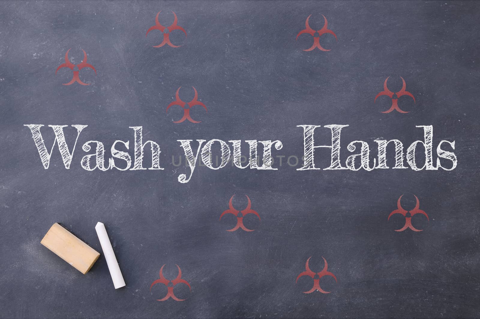 Coronavirus pandemic behaviour rules or health advice. Wash your hands chalkboard inscription.
