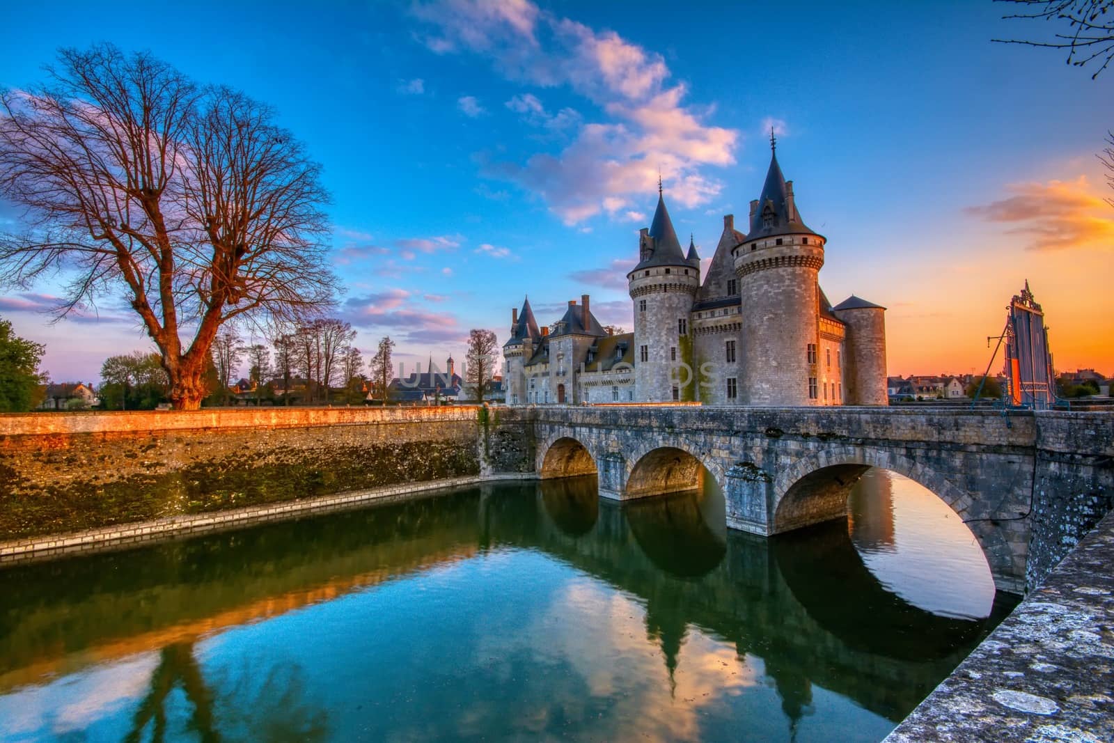 Sully Sur Loire, France - April 13, 2019: Famous medieval castle Sully sur Loire at sunset, Loire valley, France. The chateau of Sully sur Loire dates from the end of the 14th century.