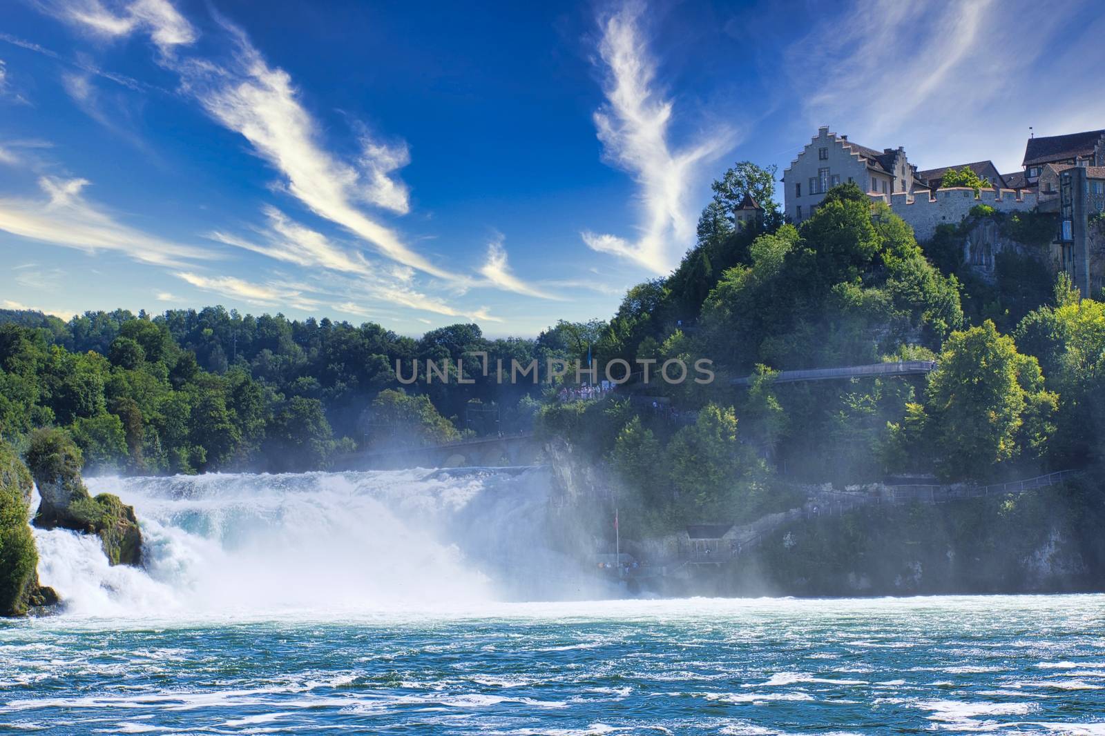 the famous rhine falls in the swiss near the city of Schaffhausen - sunny day and blue sky