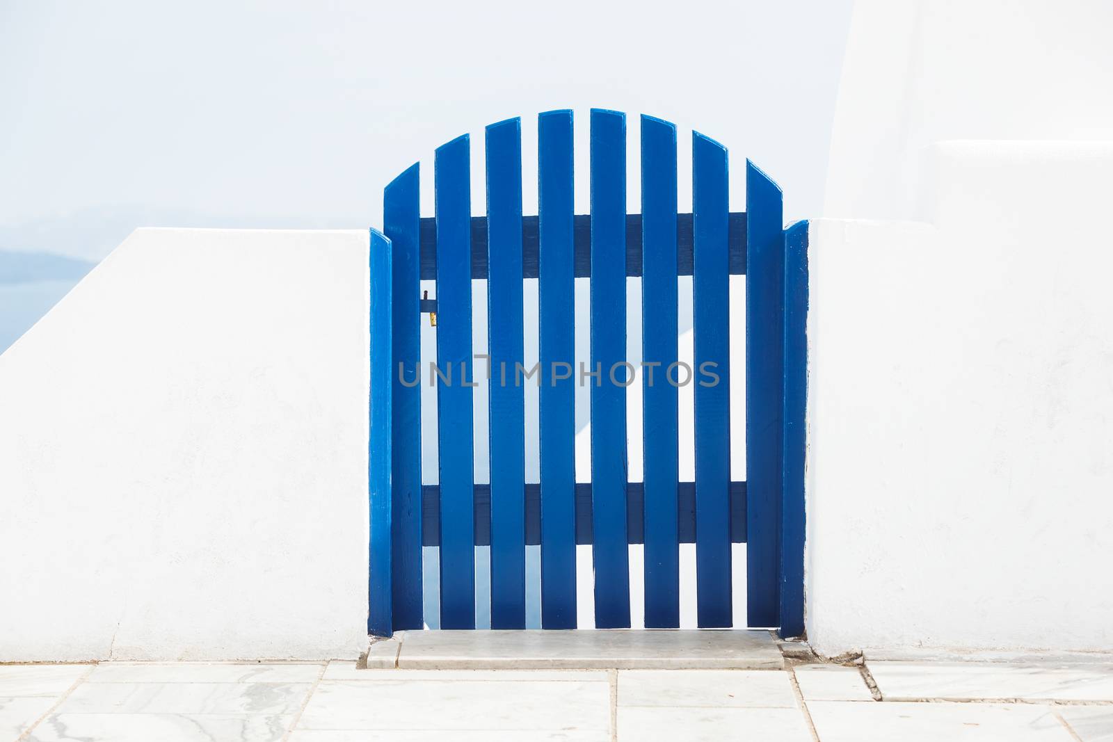 Blue wooden gate in front of the sea,Greece, Santorini, Oia, by Slast20