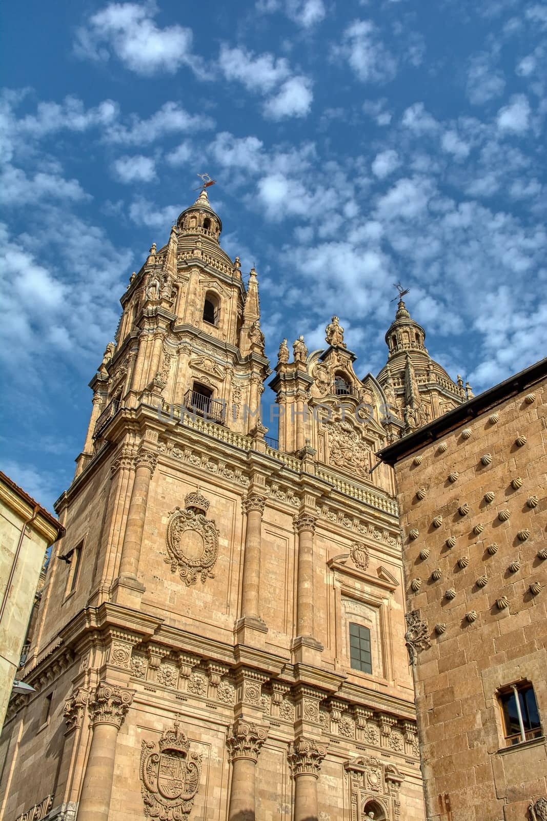 Famous Casa de las Conchas with La Clerecia Church in Salamanca, Spain by CreativePhotoSpain