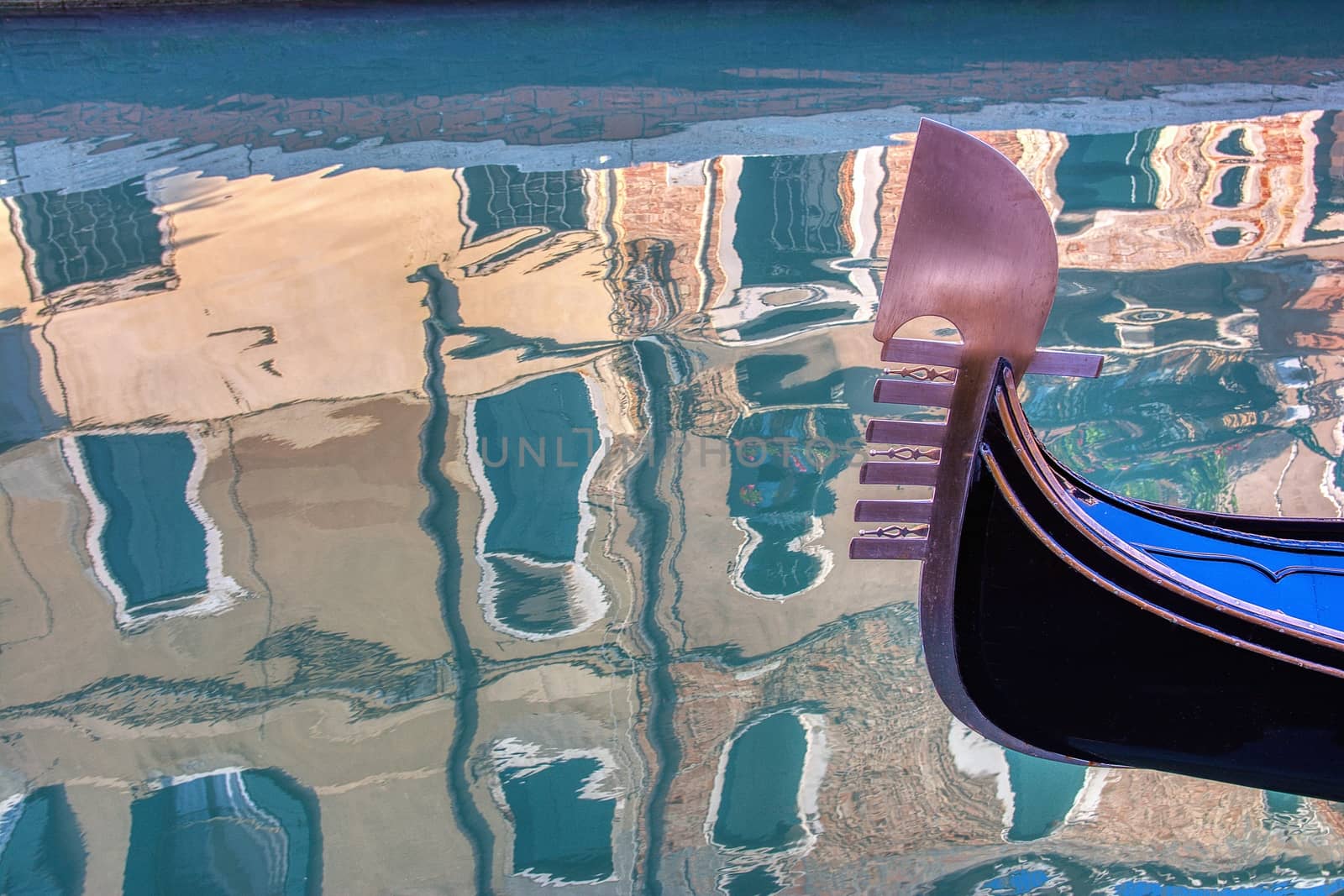 Venice gondola and reflection of buildings in water,Venice,Italy